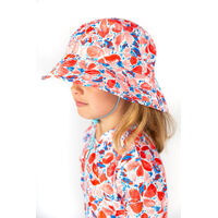 side view of a girl wearing Swim Hat CORAL
    		